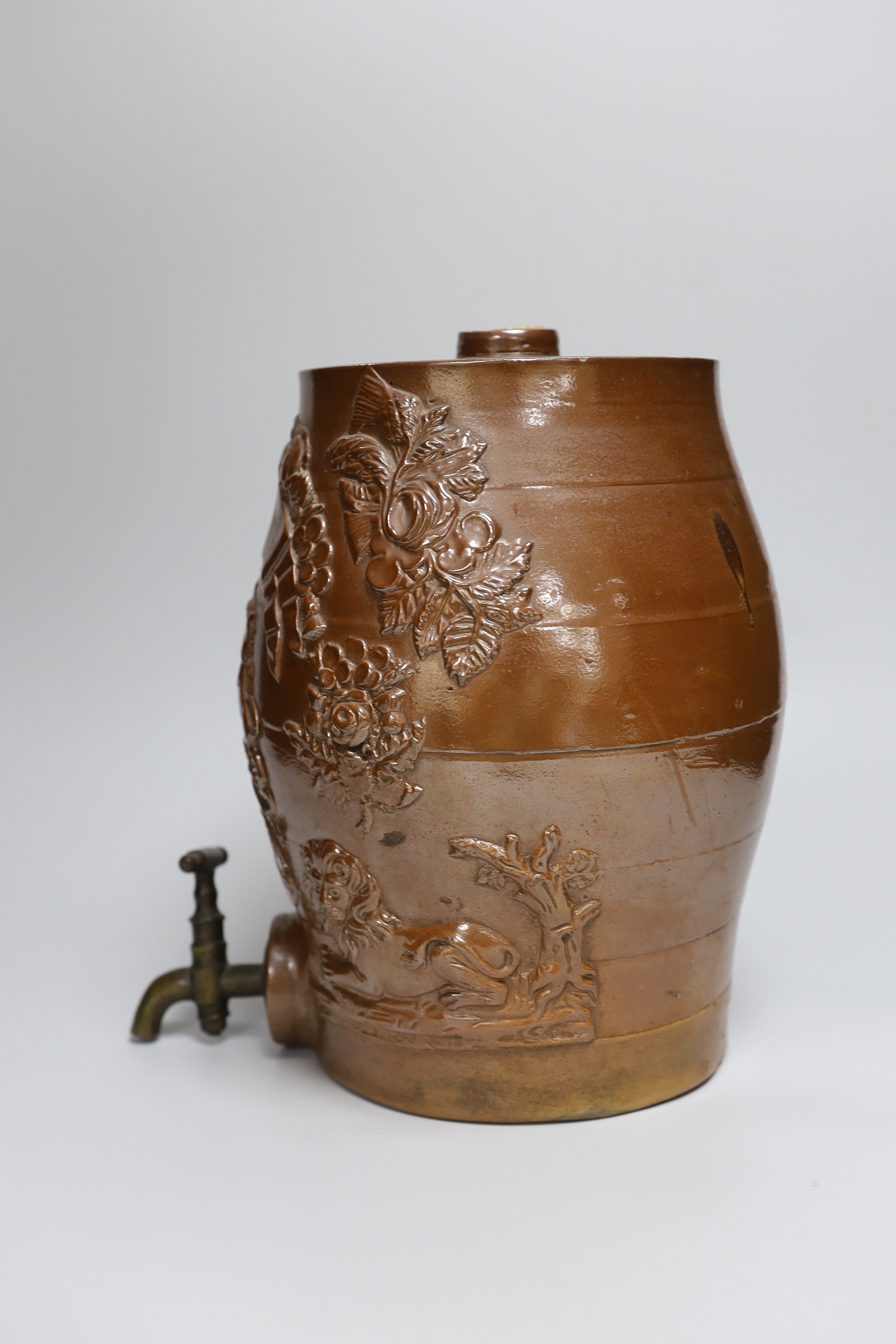 A mid 19th century Brampton brown salt glazed stoneware two gallon spirit barrel, moulded with the arms of the Prince of Wales and his birthday, November 9th 1841, fitted with a brass spigot, 28cm